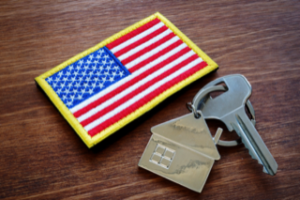 Desk with American Flag patch and house keys on it