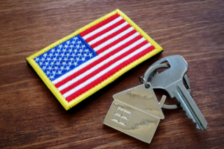 Desk with American Flag patch and house keys on it